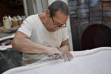 Mature latin man working the wood