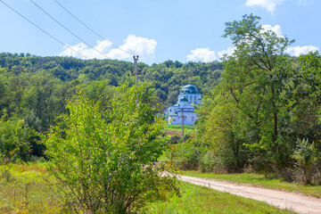 Obraz premium rustic church situated near the forest