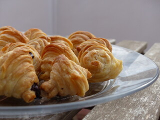 Small croissants filled with chocolate, freshly baked. Baked pastries. French pastry