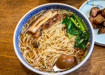 Popular China Suzhou noodle soup with pork, tea egg and vegetable.