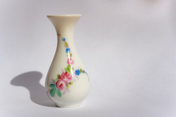 little porcelain vase with flowers, antique collection, porcelain figures