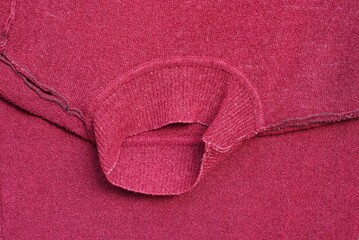 red crumpled fabric texture on an old sweater