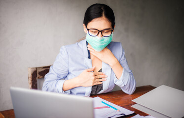 Corona virus, or Covid-19, is spreading all over the world. Business women wear masks Because he...