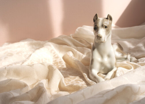little porcelain figure of a lying dog, antique collection, porcelain figures
