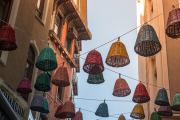 Empty wicker baskets used as lamps in the street