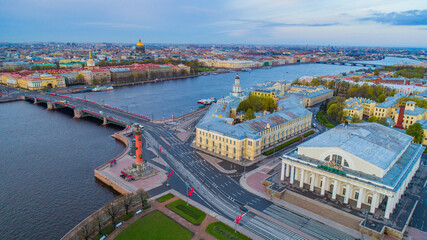Fototapeta premium Saint Petersburg. Russia. View of St. Petersburg from a height. Panorama of St. Petersburg from Vasilievsky island. Palace bridge over the Neva river. Rostral column. Early morning in the city.