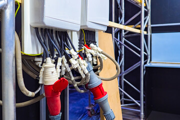 Electrical distribution boards in production. Installation of lighting in the room. Electrical installation work in the office. The work of an electrician.