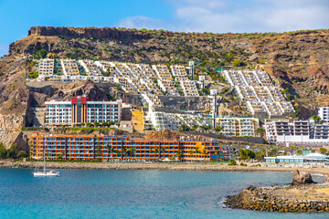 Cura beach (Spanish: Playa del Cura), rocky beach near Puerto Rico de Gran Canaria holiday resort on Gran Canaria island, Spain - obrazy, fototapety, plakaty