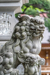 Lion-dog guardian komainu (狛犬) at the entrance of a Shrine in Tokyo, Japan