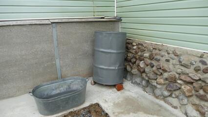 barrels for collecting rainwater from the roof