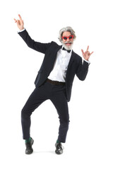 Cool senior man dancing against white background