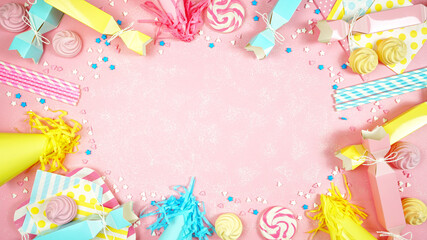 Happy birthday party pastel colors theme modern creative layout flat lay with decorations, party hats and food on pink textured background with decorated borders and negative copy space.