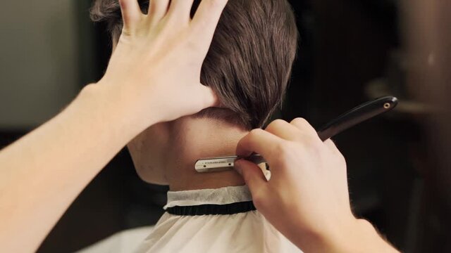 large planch haircut master shaves with a dangerous razor