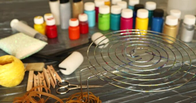 Woman applying tie dye technique to t shirt