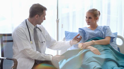 doctor giving desease treatment consulting to patient in hospital