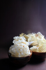 Homemade sundried potato chips and sago wafers.Deepfried and served in wooden bowl.