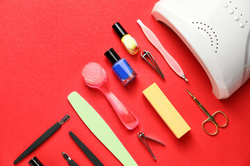 Supplies for manicure on color background