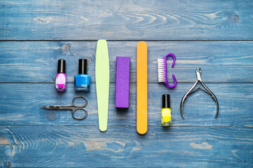 Supplies for manicure on wooden background