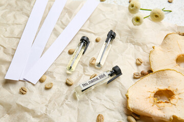 Perfume samples with ingredients on parchment