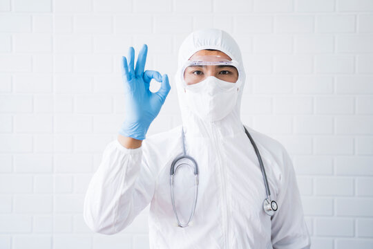 Medical healthcare scientist doctor making hand gesture ok sign wellness wearing goggles blue latex gloves white lab suit stethoscope protective bacterial infection coronavirus, hospital laboratory