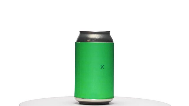 Soda or beer can with chroma green screen label with tracking points spinning on turntable stand with white background zoom in