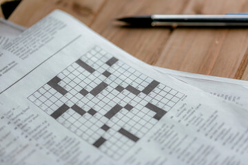 crossword puzzle and pencil