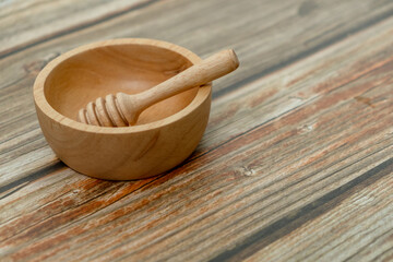 Close-up wooden bowl and wooden dripper on the floor