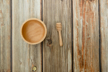 Close-up wooden bowl and wooden dripper on the floor