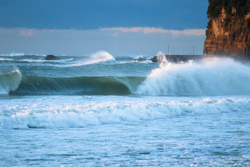 Obraz premium Large Waves from Typhoon, Hurricane, breaking, climate & ocean temperatures are rising, Surfing In Japan, Near Shidashita, Olympic Venue for surf.