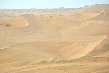 Fototapeta na wymiar sand dunes in the desert in Huacachina, Peru