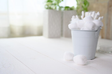 Fototapeta na wymiar White cotton swabs cotton bud and cotton ball on background