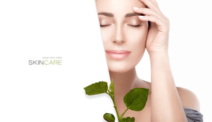 Beauty portrait of a young woman with green leaves. Spa, skin care and cosmetology concept.