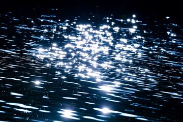 sparkles on deep blue water