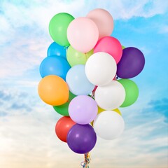 Bunch of colorful balloons on sky background