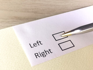 One person is answering question on a piece of paper. The person is thinking to go left or right.