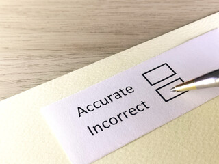 One person is answering question on a piece of paper. The person is thinking to be accurate or...