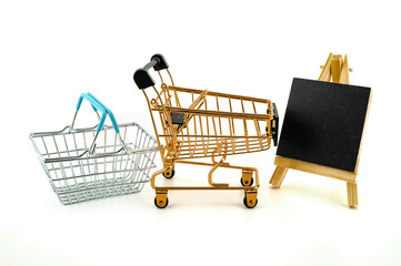 Shopping concept with shopping cart and basket