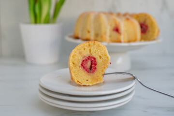 Home made sweet Raspberry Lemon Cake with tulips