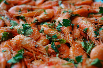 Fresh boiled prawns with coriander. A delicious dish of seafood.