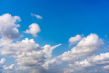 Naklejka na ściany i meble White clouds cumulus floating on blue sky in beautiful weather