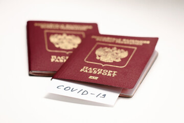 Coronavirus COVID-19 and tourism. Passport, COVID-19 inscription for travel. Quarantine. Restriction for tourists. Covid19 Corona virus disease danger pandemic spread worldwide global