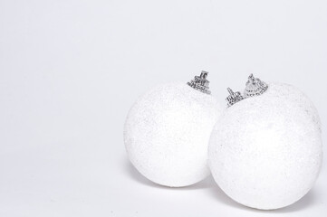 white Christmas backdrop with three balls