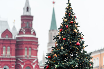 Fototapeta premium Christmas tree decorated with balls and space toys at The Red Square in Moscow.