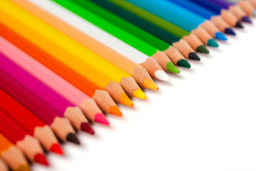 Multicolored pencils isolated on a white background. Free space for text. Education frame concept.
