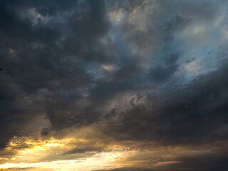 Naklejka na ściany i meble Twilight sky with dark cloudy. Dramatic moody. Sunset at the end of the horizon.