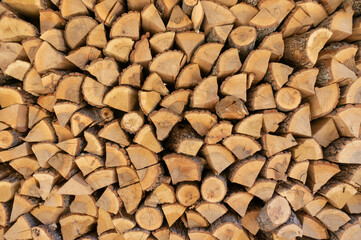 Wall of chopped firewood, Background of dry chopped firewood logs in a pile
