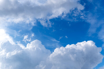 Obraz na płótnie Canvas Bright pop blue sky with white clouds. Great background