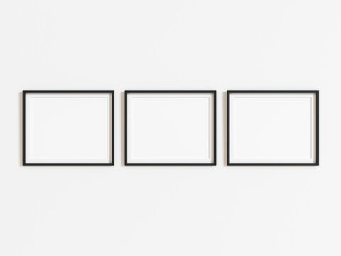 Three black horizontal frames mockup on white wall. 3d illustration.