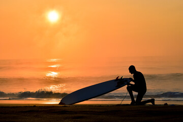 Silhoette Surfer on a misty beach in Chiba Japan with a stunning sunrise and waves. Lifestyle,surfboard,surfing,Japansurf
