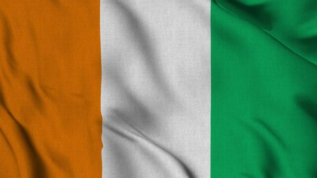 Ivory Coast Cote D Ivoire national flag waving with fabric texture fluttering in wind in a seamless loop in smooth slowmotion animation background